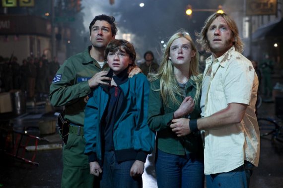 Left to right: Kyle Chandler plays Jackson Lamb, Joel Courtney plays Joe Lamb, Elle  Fanning plays Alice Dainard, and Ron Eldard plays Louis Dainard in SUPER 8, from  Paramount Pictures. Photo credit: François Duhamel  © 2011 Paramount Pictures. All Right